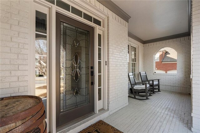 183 Applewood Ln, Acworth, GA 30101 - doorway to property featuring covered porch and brick siding