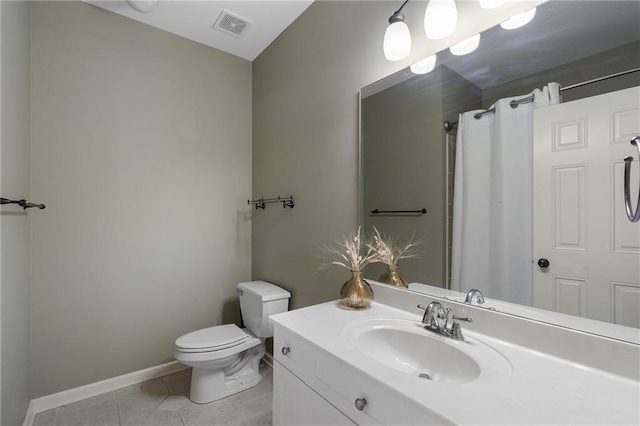 bathroom with vanity, tile patterned floors, and toilet