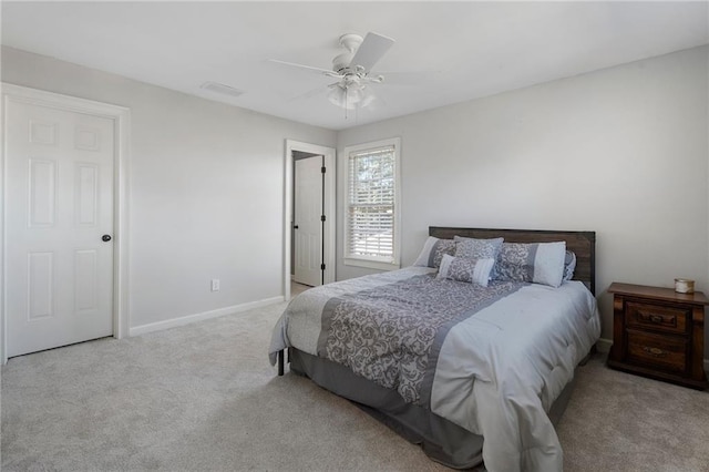 carpeted bedroom with ceiling fan