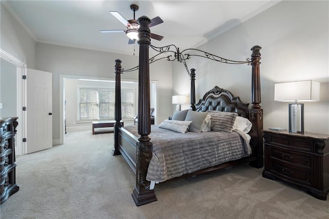 carpeted bedroom featuring ornamental molding and ceiling fan