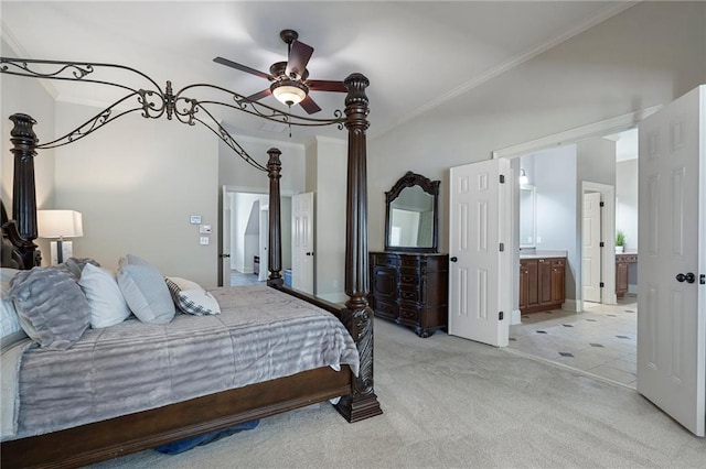 bedroom featuring crown molding, ceiling fan, connected bathroom, and light colored carpet