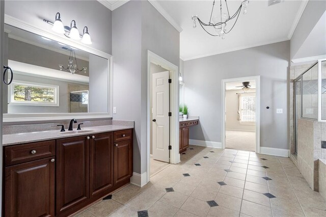 bathroom featuring vanity, an enclosed shower, a wealth of natural light, and tile patterned floors