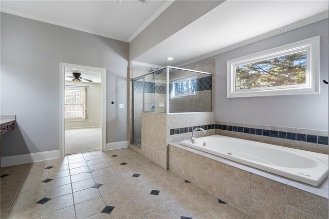 bathroom featuring tile patterned flooring, crown molding, and separate shower and tub