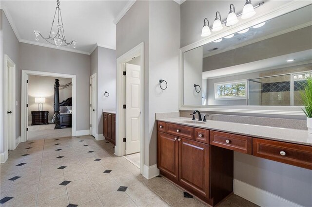 bathroom featuring crown molding, a shower with door, tile patterned flooring, an inviting chandelier, and vanity