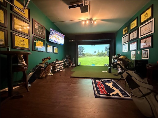 recreation room with golf simulator and hardwood / wood-style floors