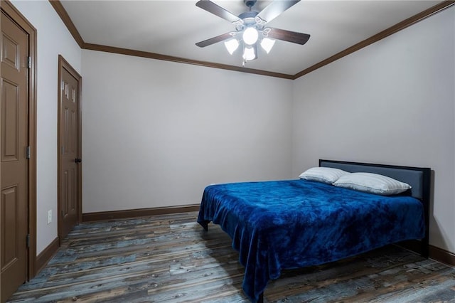 bedroom featuring ornamental molding, dark wood-type flooring, and ceiling fan