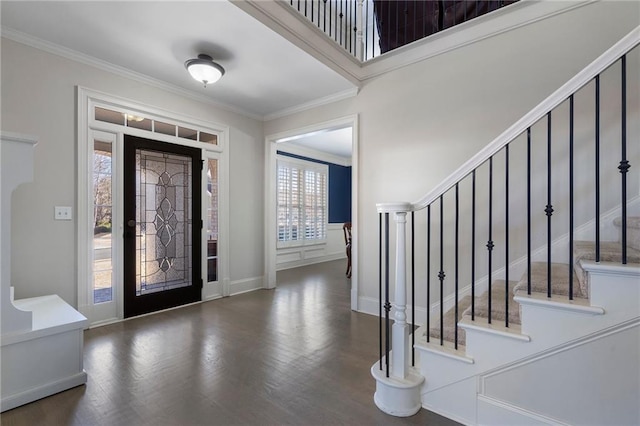 entryway with crown molding and dark hardwood / wood-style flooring