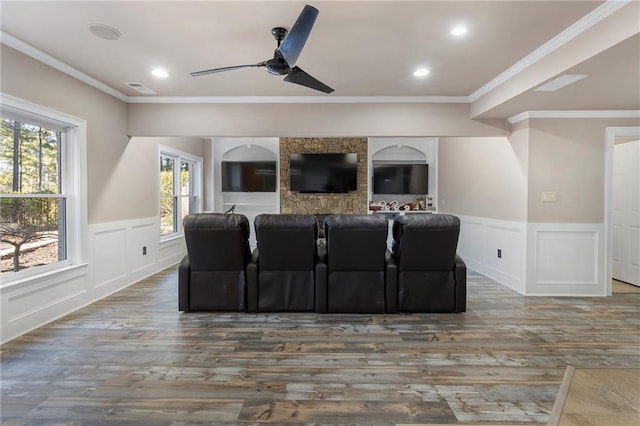 183 Applewood Ln, Acworth, GA 30101 - home theater room featuring a ceiling fan, wood finished floors, wainscoting, a decorative wall, and crown molding