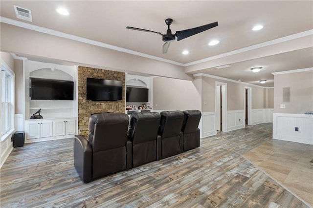 183 Applewood Ln, Acworth, GA 30101 - home theater room featuring ceiling fan, a wainscoted wall, wood finished floors, crown molding, and a decorative wall