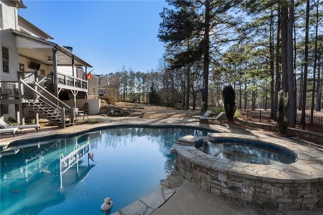183 Applewood Ln, Acworth, GA 30101 - view of swimming pool featuring stairway, ceiling fan, a pool with connected hot tub, and a patio area