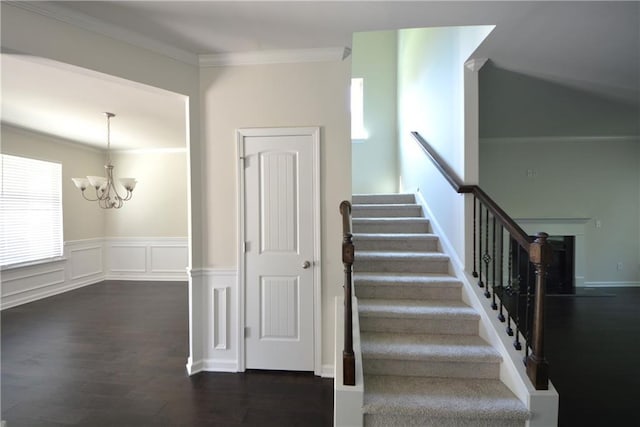2307 Overlook Ave, Lithonia, GA 30058 - staircase with a chandelier, ornamental molding, and wood finished floors