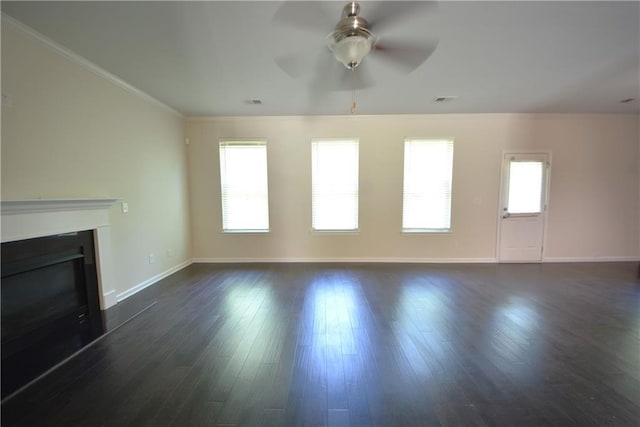 2307 Overlook Ave, Lithonia, GA 30058 - unfurnished living room with a glass covered fireplace, ceiling fan, baseboards, dark wood-style flooring, and crown molding