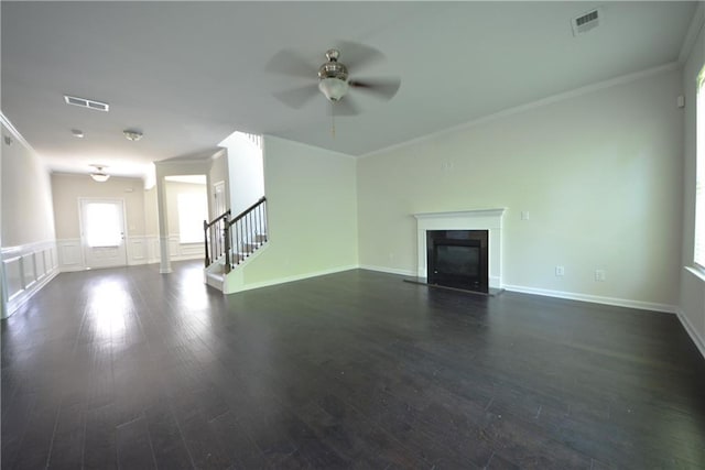 2307 Overlook Ave, Lithonia, GA 30058 - unfurnished living room with ornamental molding, ceiling fan, a fireplace with flush hearth, stairway, and dark wood finished floors