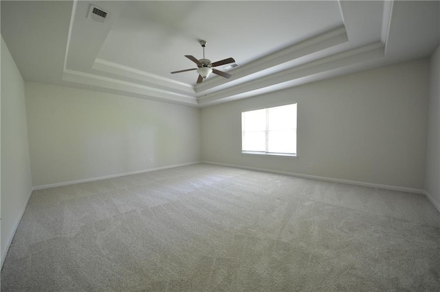 2307 Overlook Ave, Lithonia, GA 30058 - unfurnished room featuring a raised ceiling, carpet floors, a ceiling fan, and baseboards