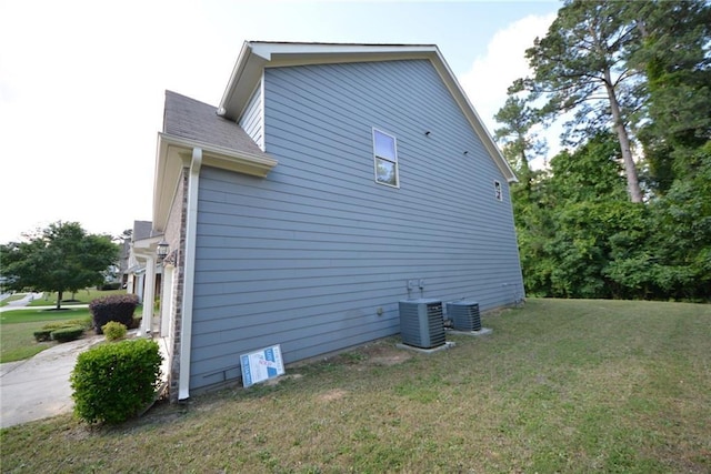 2307 Overlook Ave, Lithonia, GA 30058 - view of side of home featuring cooling unit and a lawn
