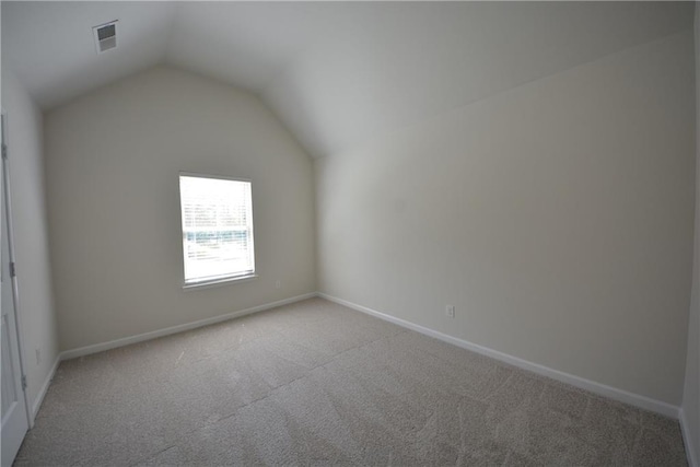 2307 Overlook Ave, Lithonia, GA 30058 - bonus room featuring light colored carpet, lofted ceiling, and baseboards
