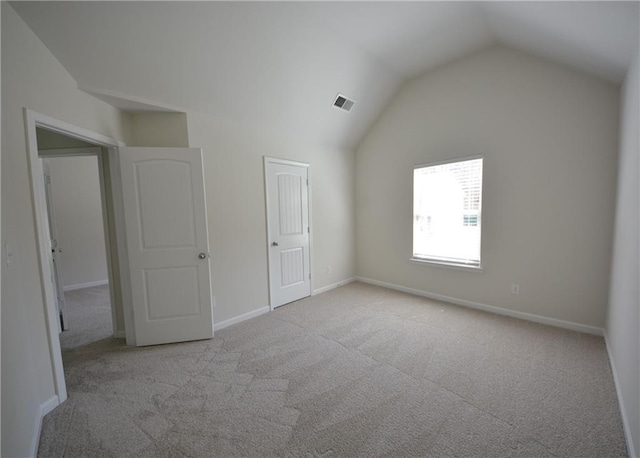 2307 Overlook Ave, Lithonia, GA 30058 - unfurnished bedroom with carpet, vaulted ceiling, and baseboards