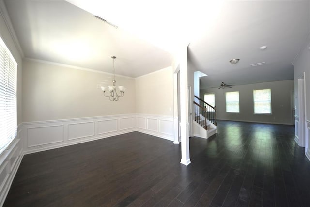 2307 Overlook Ave, Lithonia, GA 30058 - unfurnished dining area featuring stairway, dark wood-style floors, a chandelier, wainscoting, and ceiling fan