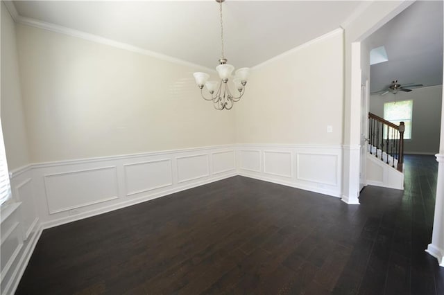 2307 Overlook Ave, Lithonia, GA 30058 - spare room featuring a chandelier, dark wood-style flooring, wainscoting, stairway, and crown molding