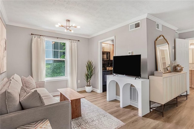 living area with light wood finished floors, a chandelier, crown molding, baseboards, and a textured ceiling