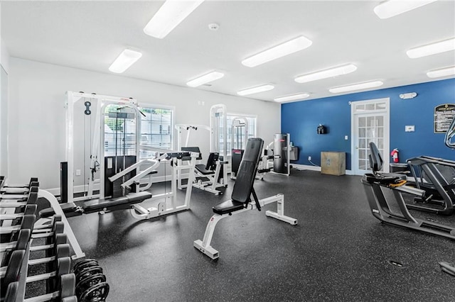 gym featuring baseboards