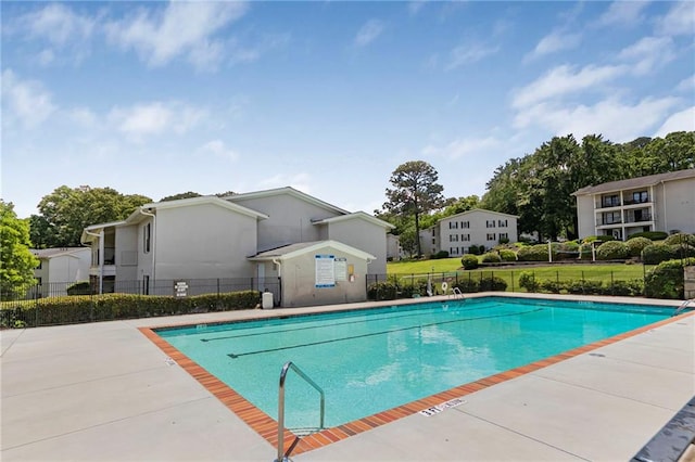 community pool featuring fence