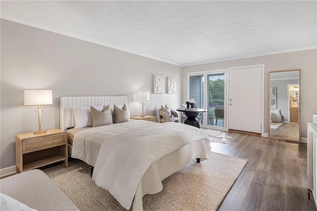bedroom with access to outside, wood finished floors, crown molding, and baseboards