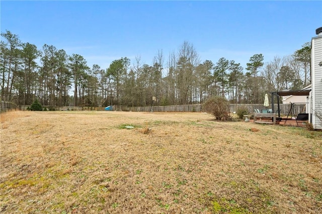 view of yard featuring a wooden deck