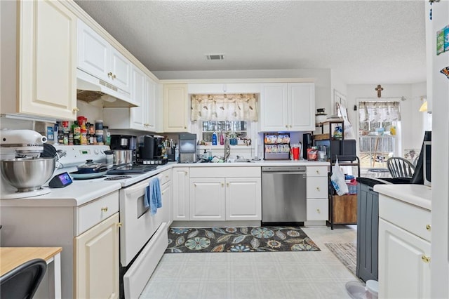 kitchen featuring white cabinetry, sink, stainless steel dishwasher, a textured ceiling, and electric stove