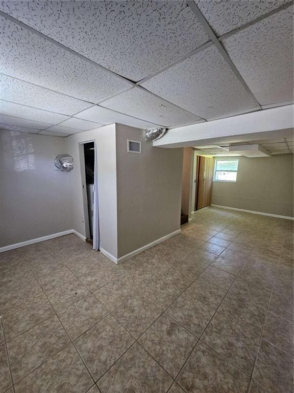 basement featuring a drop ceiling