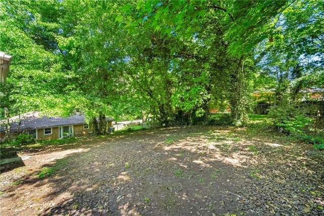 rear view of property featuring a sunroom