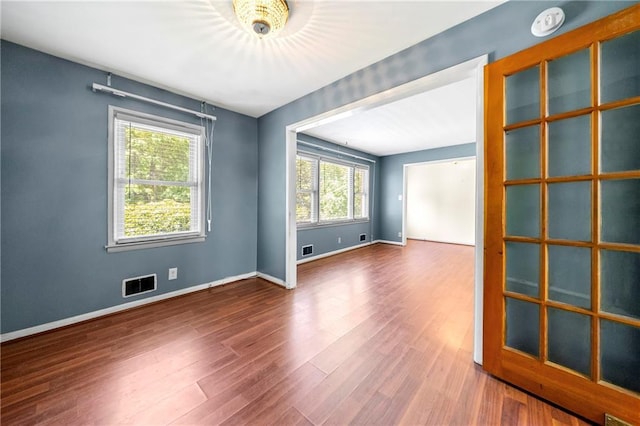 unfurnished room featuring hardwood / wood-style floors