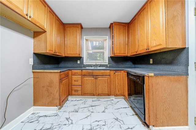 kitchen featuring sink, backsplash, and black dishwasher