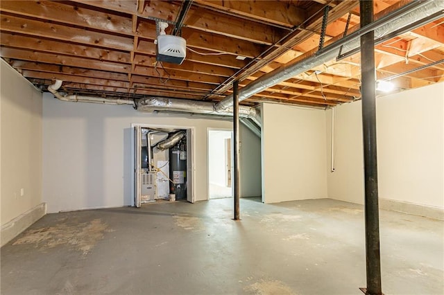 unfinished basement featuring electric water heater