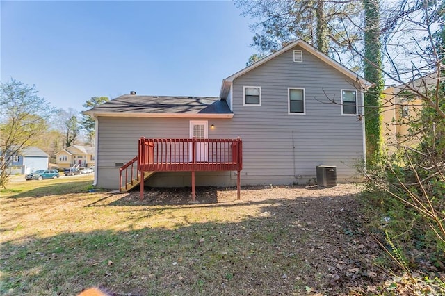 rear view of property with cooling unit, a lawn, and a wooden deck