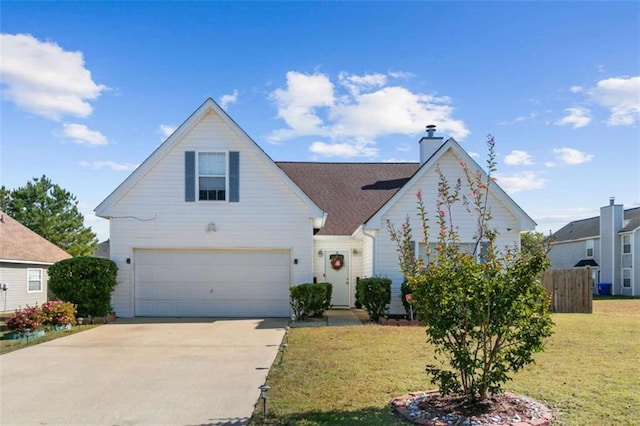 view of front of property with a garage and a front lawn