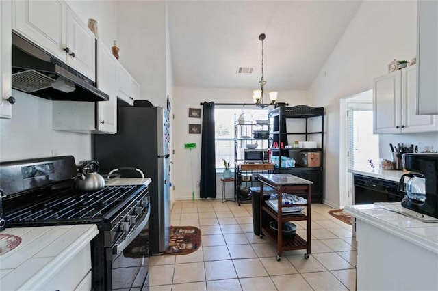 kitchen with tile countertops, black appliances, and white cabinets