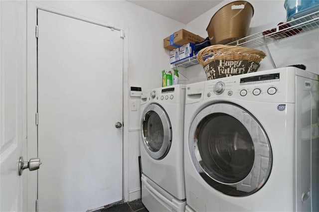 laundry area with independent washer and dryer