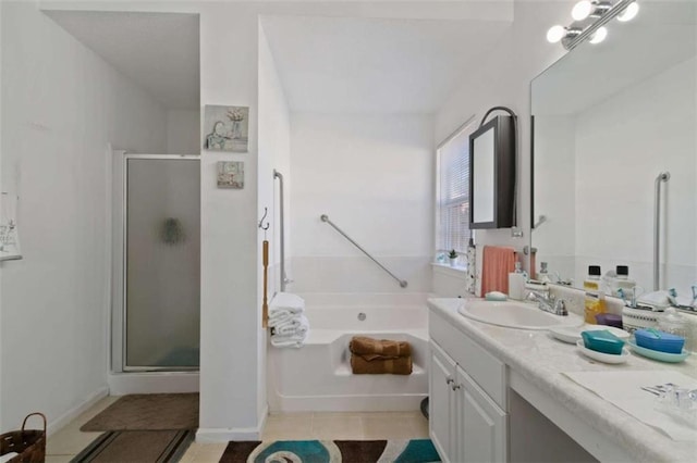 bathroom with vanity, tile patterned floors, and plus walk in shower