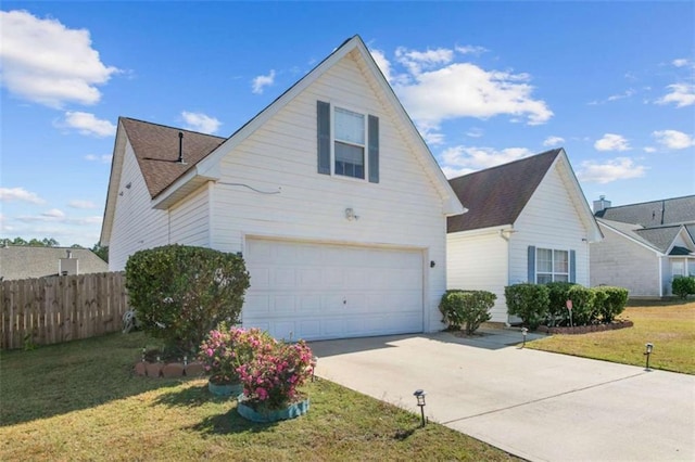 view of front of house with a garage and a front yard