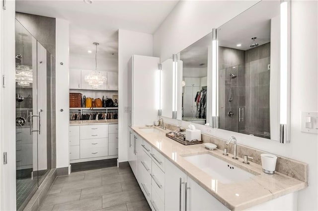 bathroom with vanity and a shower with shower door