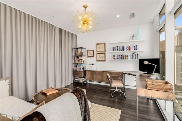 office area with baseboard heating, dark hardwood / wood-style flooring, and a notable chandelier