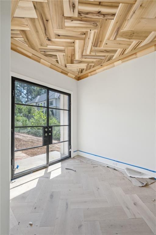 unfurnished room with baseboards
