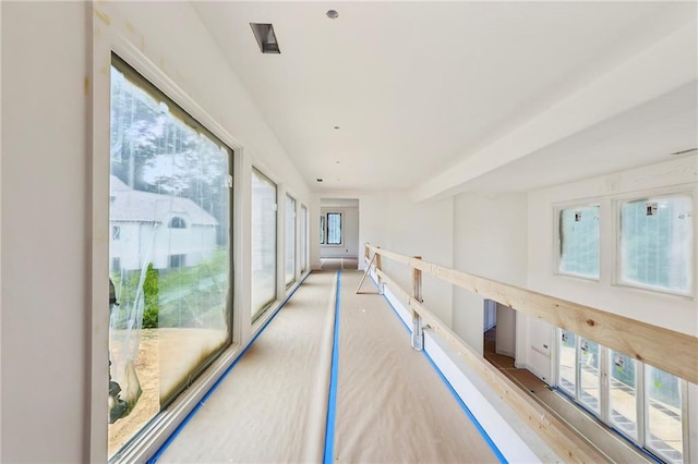 corridor with light hardwood / wood-style floors