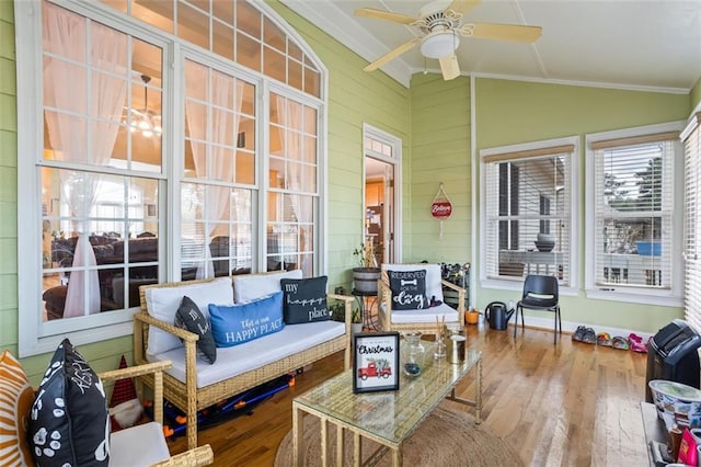 sunroom featuring a ceiling fan and vaulted ceiling