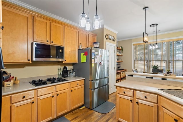 kitchen featuring wood finished floors, stainless steel appliances, crown molding, and light countertops