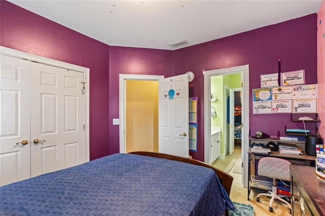 bedroom featuring visible vents and a closet