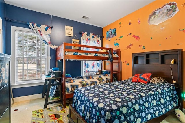 bedroom with visible vents and baseboards