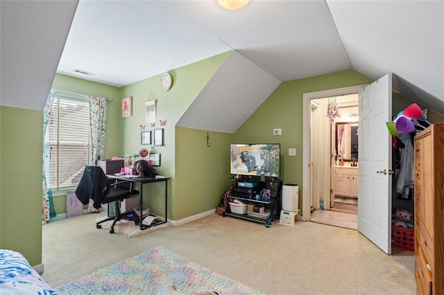 carpeted bedroom featuring lofted ceiling, baseboards, visible vents, and ensuite bathroom