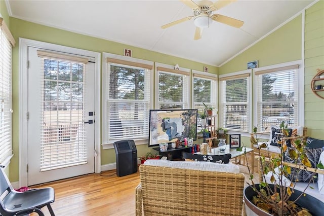 sunroom with lofted ceiling, a wealth of natural light, and ceiling fan